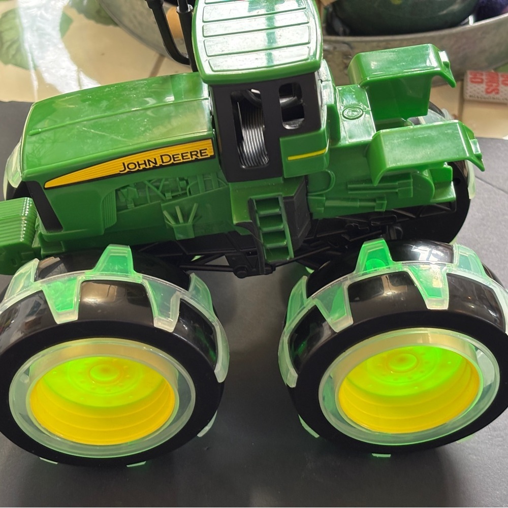 John Deere tractor with light up wheels. Like new condition. - Picture 4 of 6